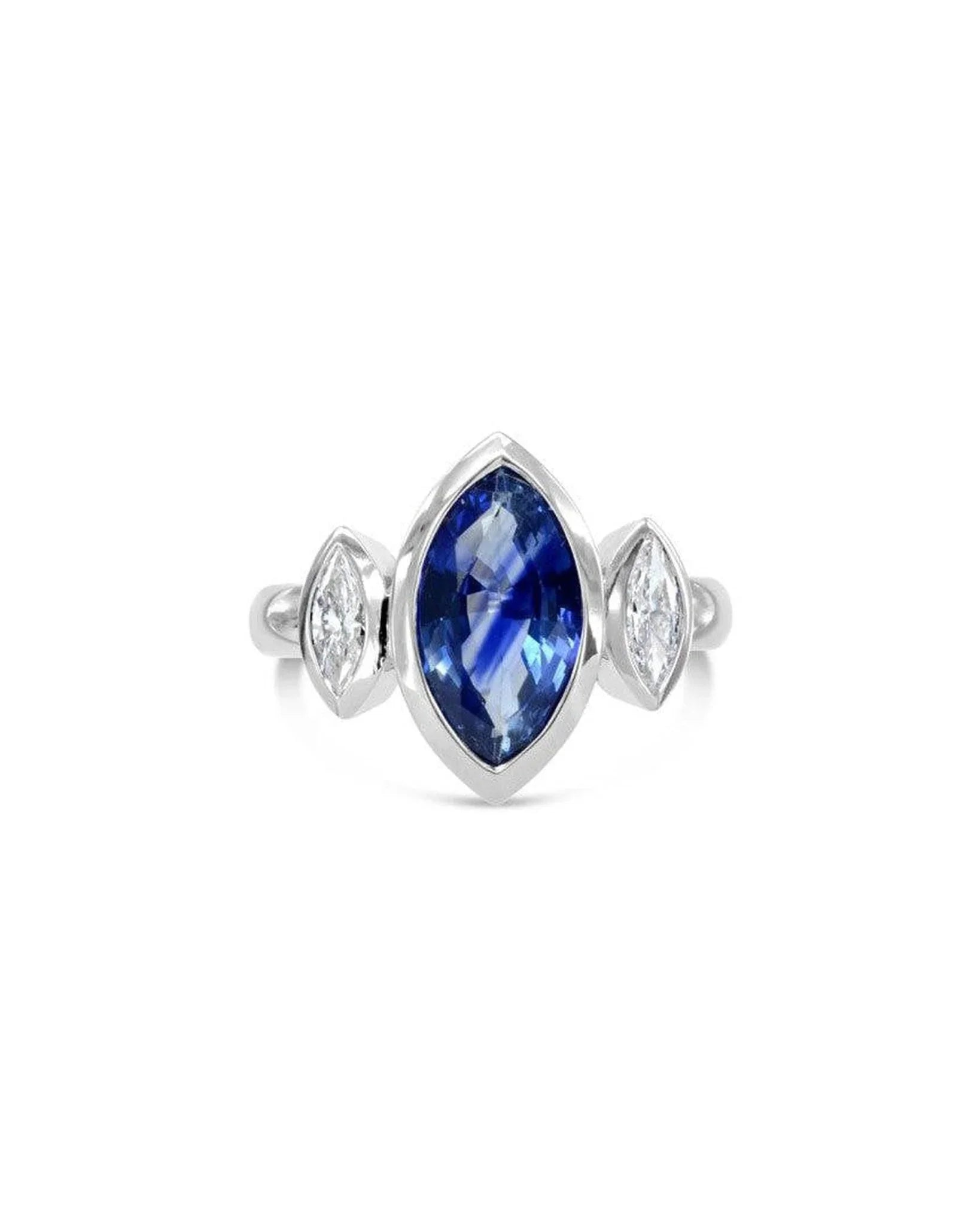 Marquise cut sapphire and diamond trilogy ring with white gold band