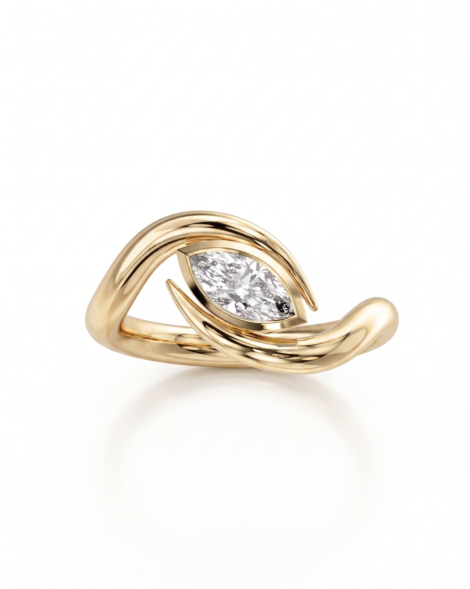Gold marquise cut spiky engagement ring with a diamond.