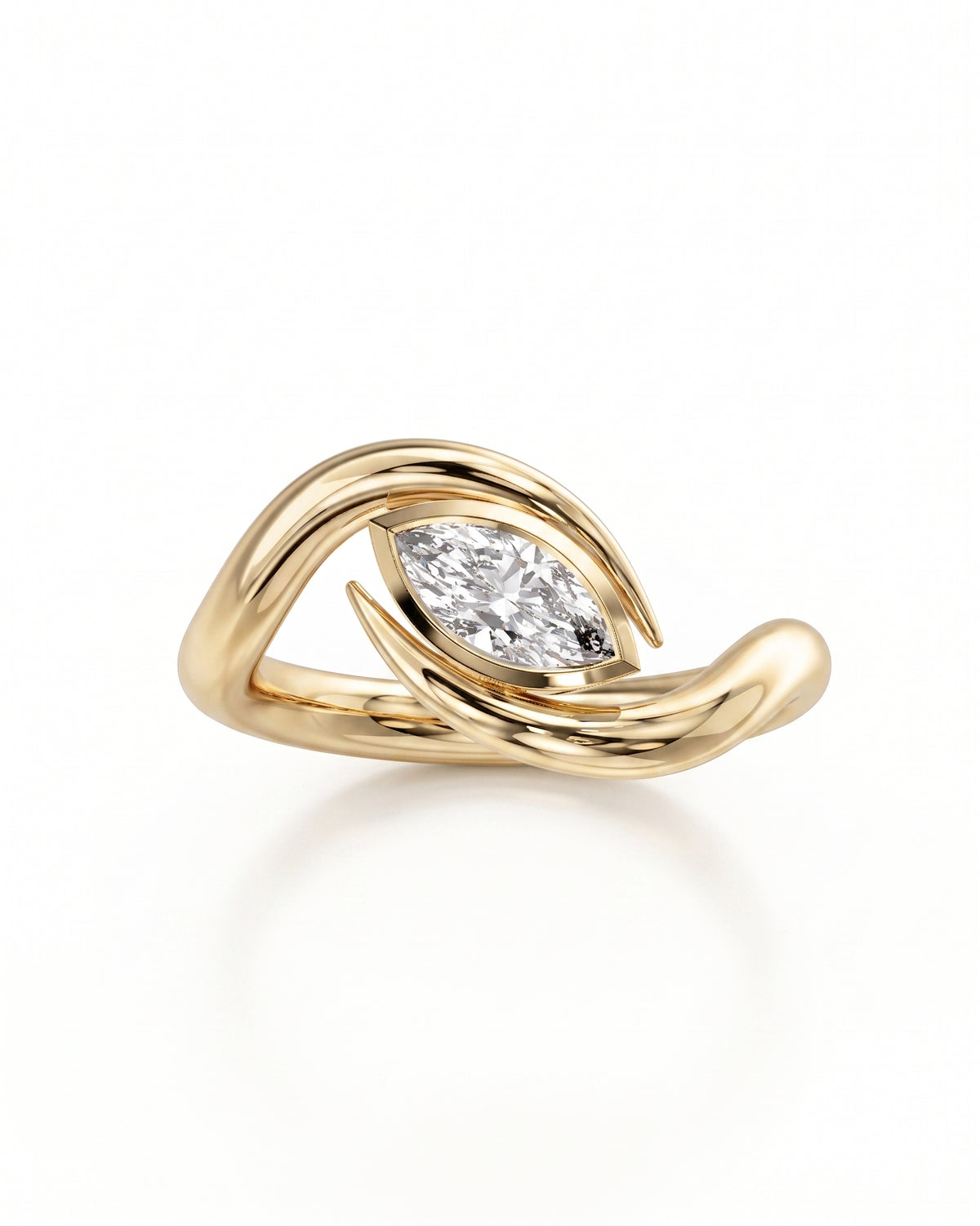Gold engagement ring featuring a marquise cut diamond set in a curved, spiky bypass band.