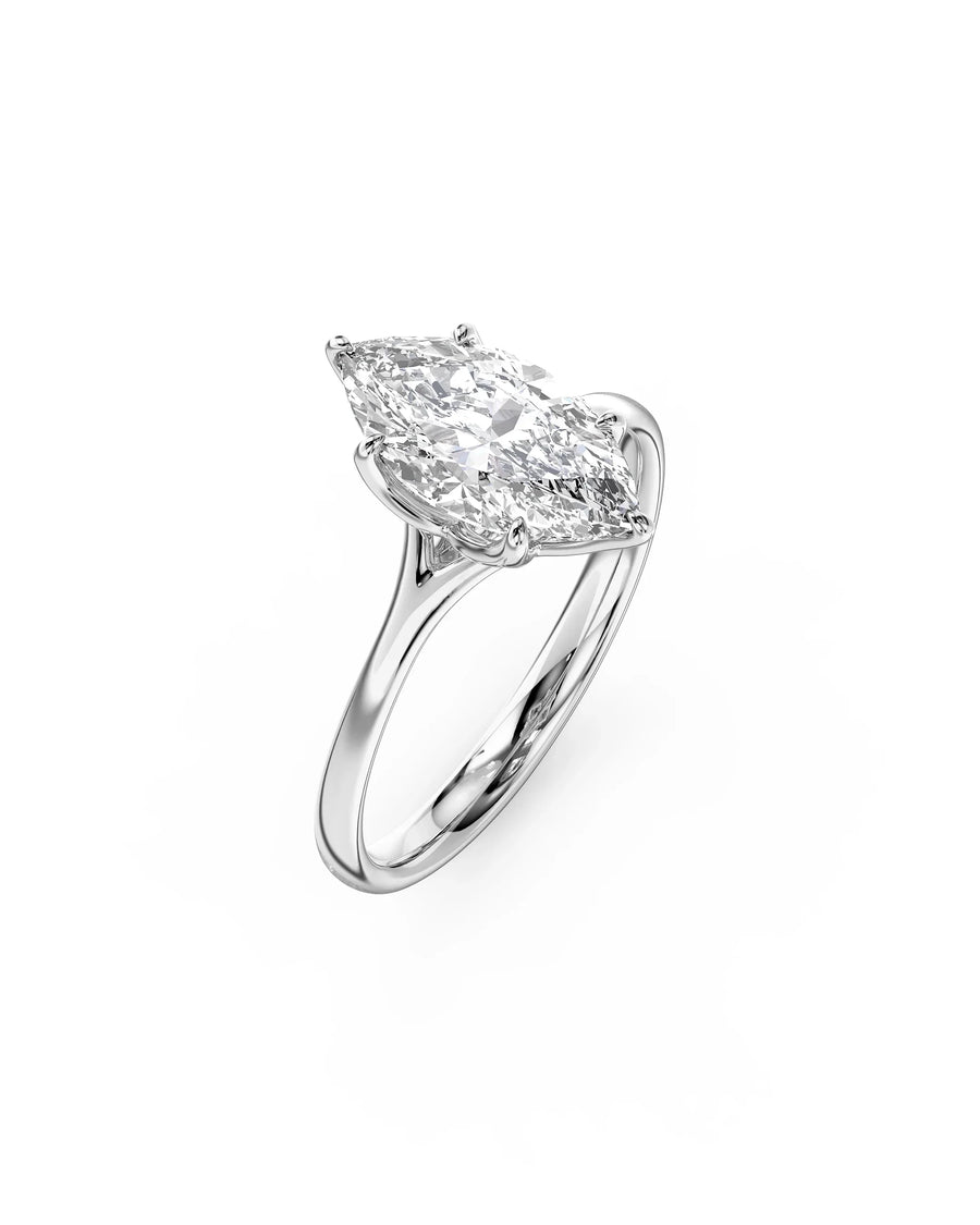 Silver engagement ring with a marquise cut diamond in a tulip claw setting.
