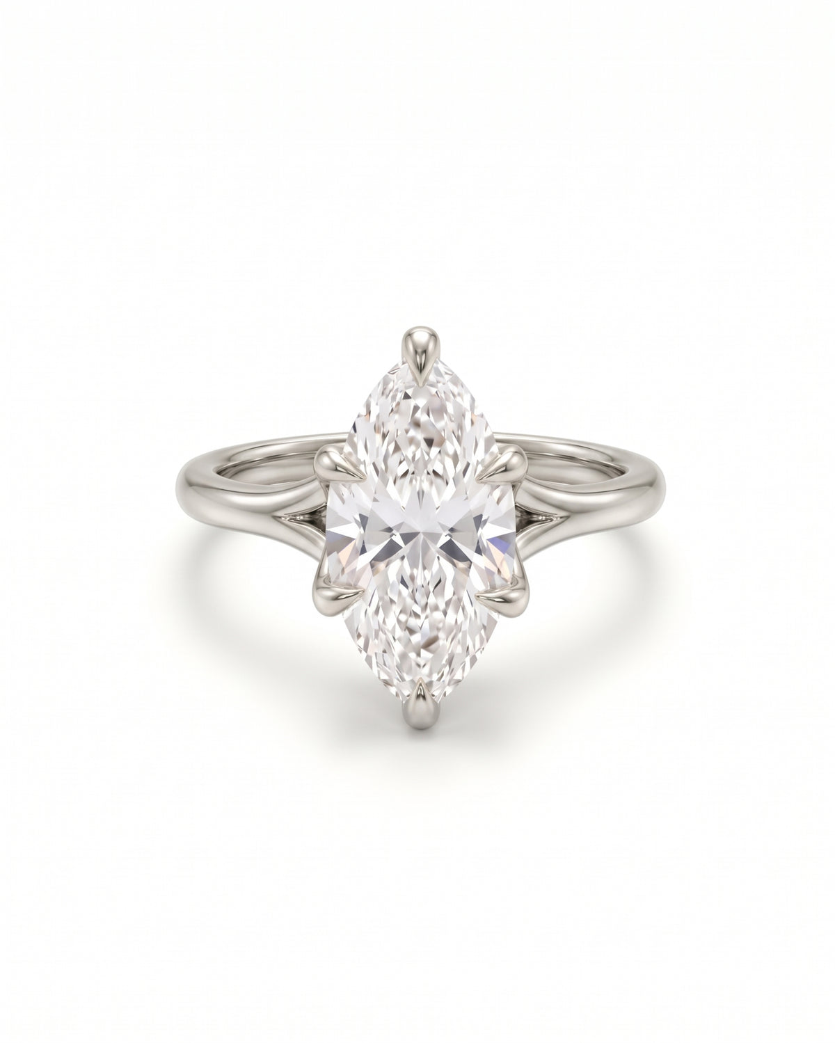 Marquise cut diamond engagement ring in a platinum tulip claw setting on a plain band.