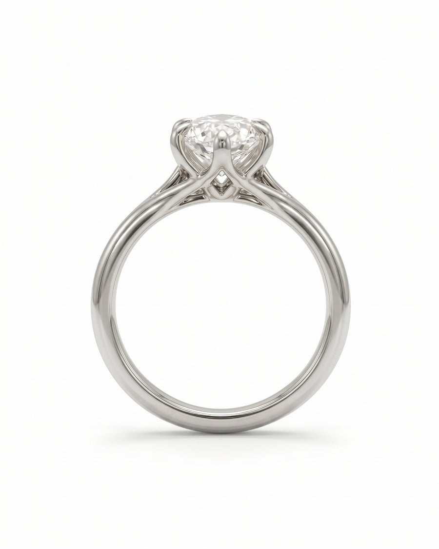 Marquise cut diamond engagement ring in polished platinum with a tulip-style claw setting.