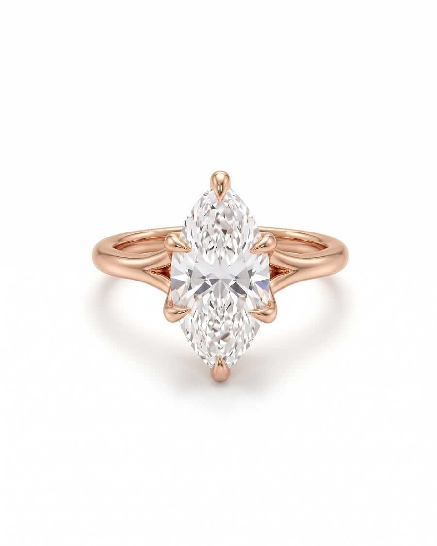 Marquise cut diamond engagement ring in rose gold with a tulip-style claw setting.