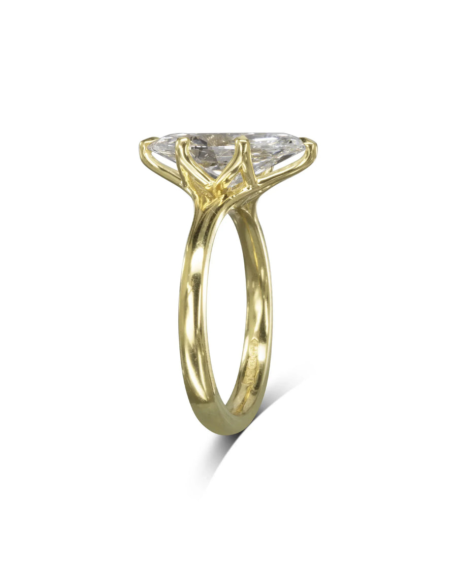 Marquise cut diamond engagement ring in a yellow gold tulip claw setting.