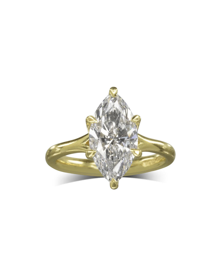 Marquise cut diamond engagement ring set in a yellow gold tulip claw setting.