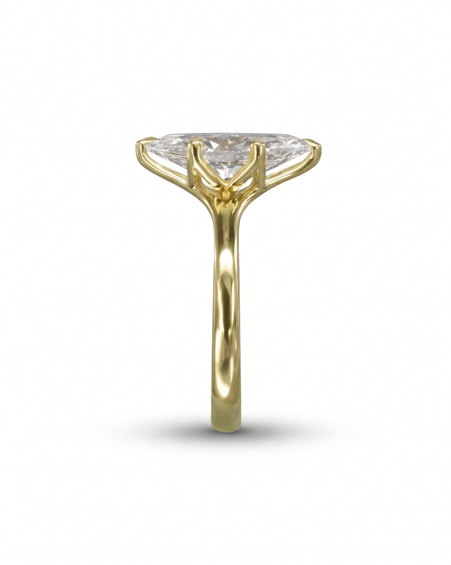 Marquise cut diamond engagement ring in yellow gold with a tulip claw setting.