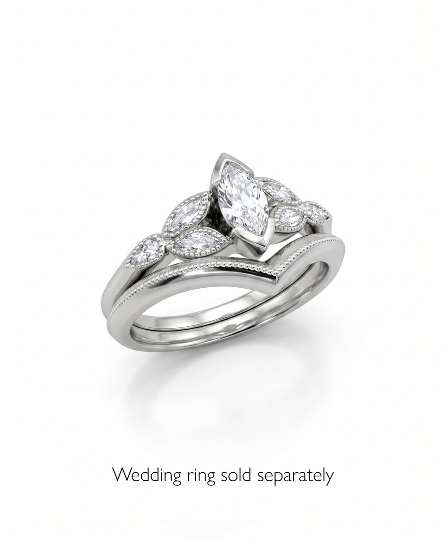 Silver marquise cut vintage engagement ring with diamond accents.