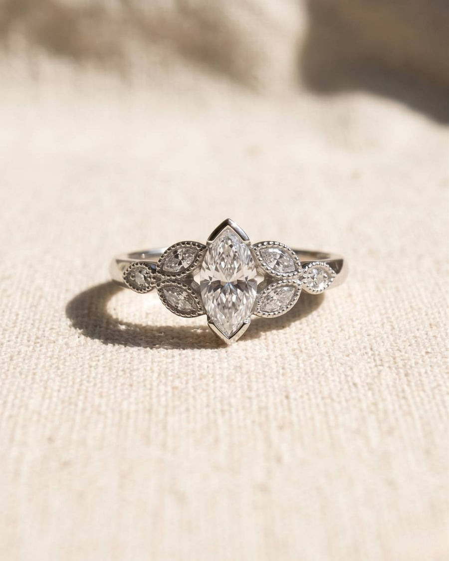 Platinum marquise cut vintage engagement ring with lab-grown diamonds.