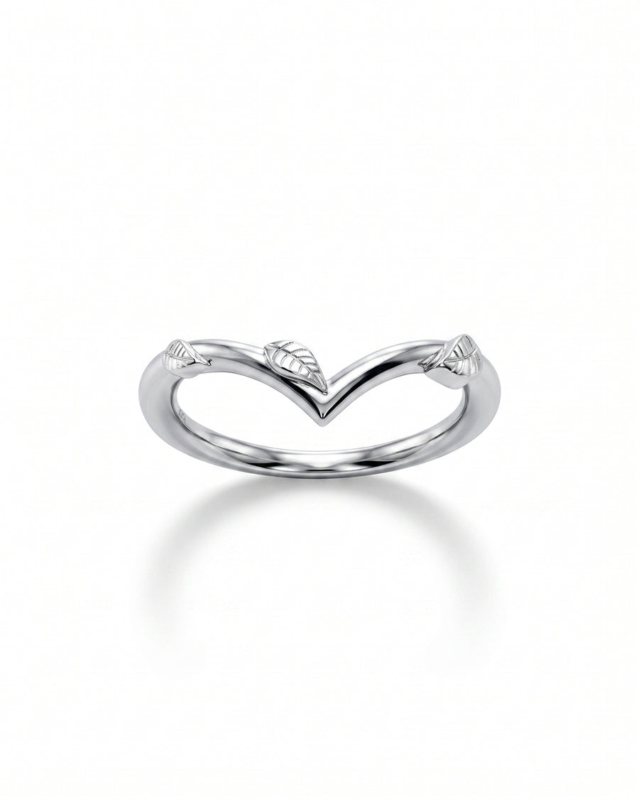 Silver wedding band with a V-shaped curve and delicate leaf accents.