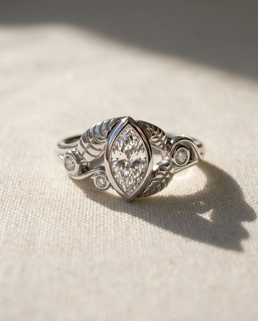 White gold marquise diamond floral wedding ring with leaf details.