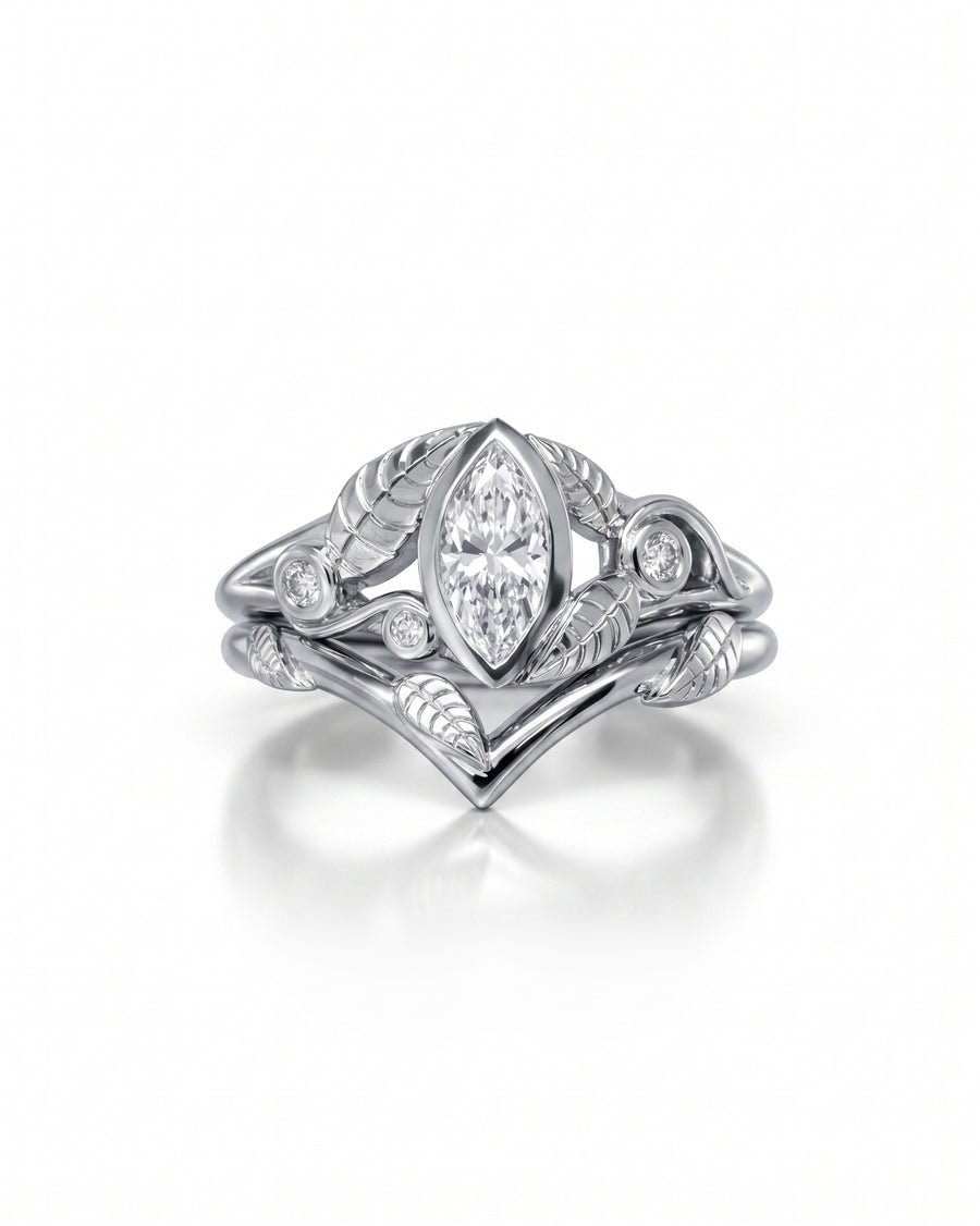 Silver marquise diamond floral wedding and engagement ring set with leaf details.
