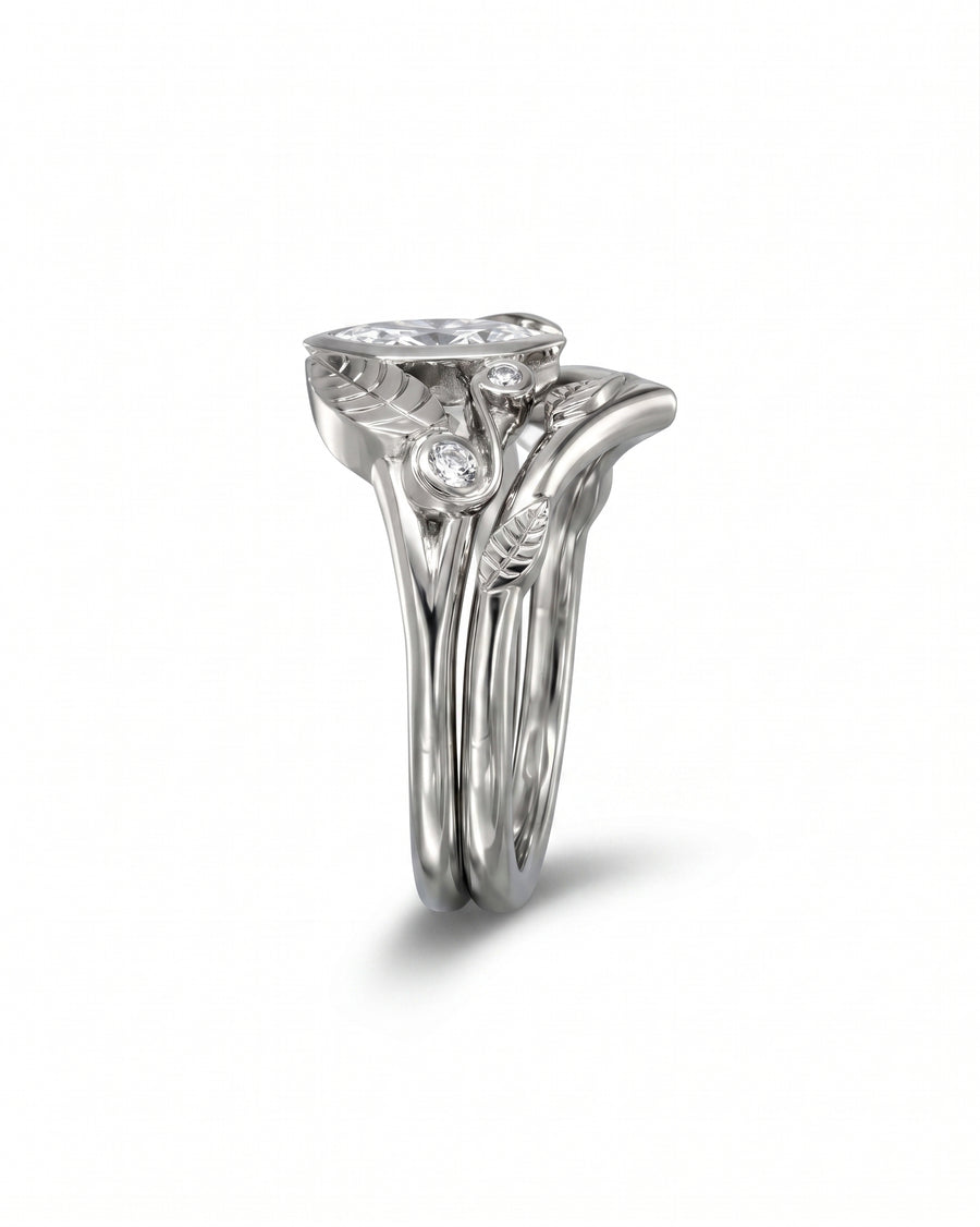 Silver marquise diamond floral wedding and engagement ring set.