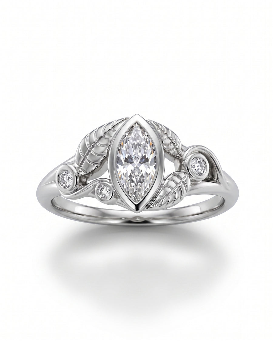 Silver ring with a marquise diamond center and floral leaf design.