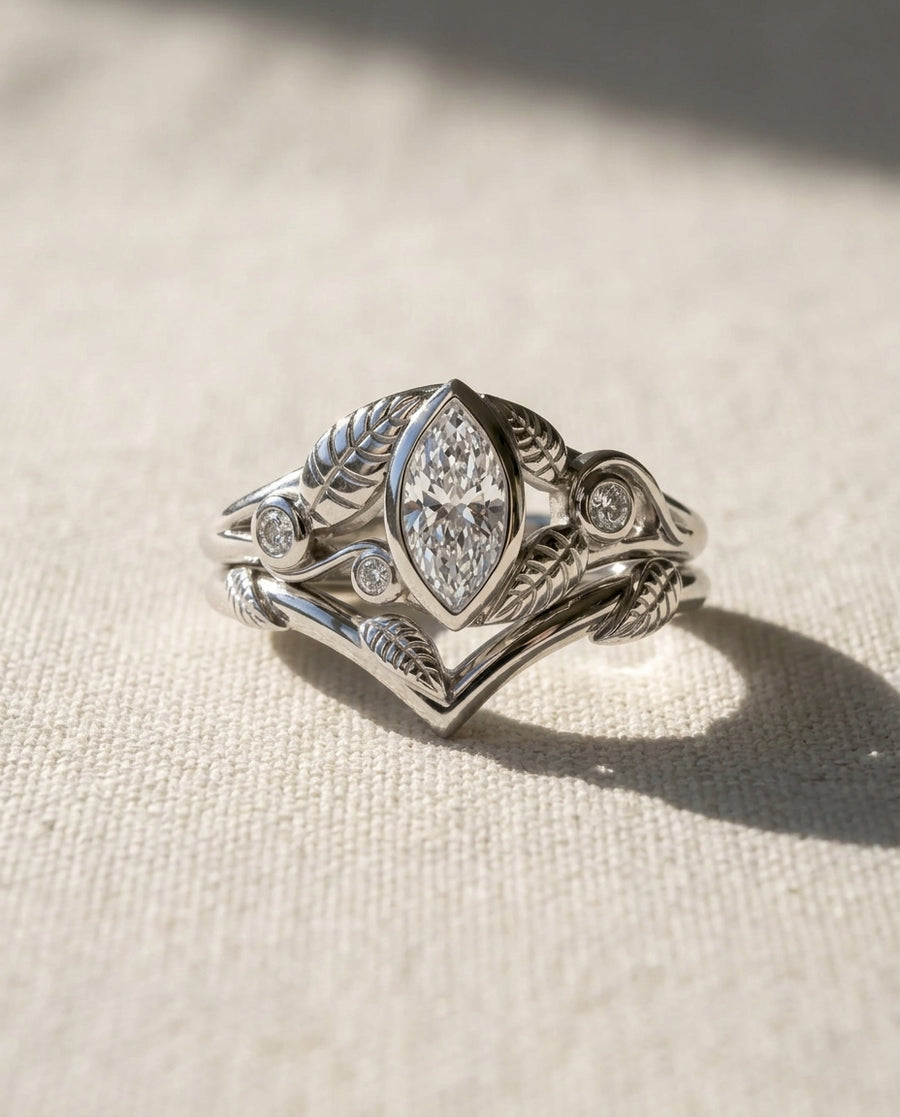 Platinum marquise diamond floral engagement ring set.