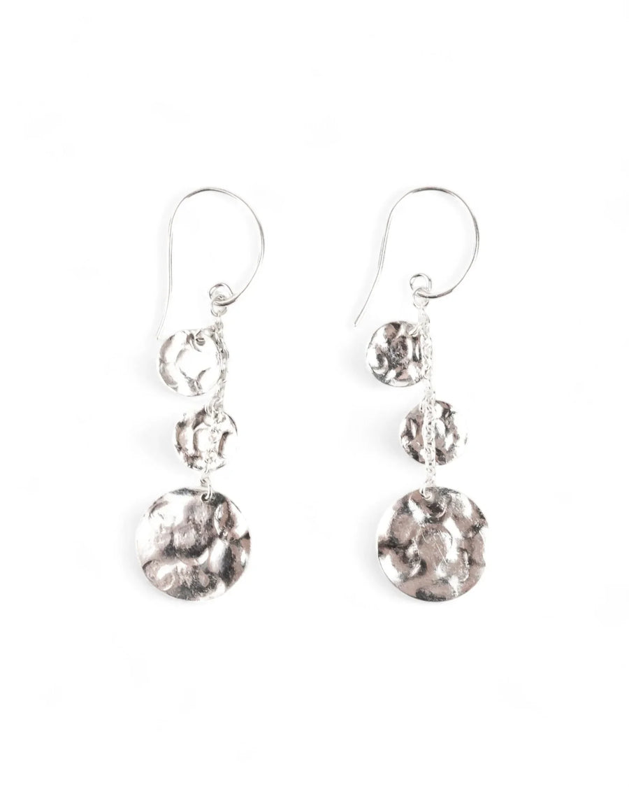 Silver hammered disc dangle earrings with organic textured finish on a white background