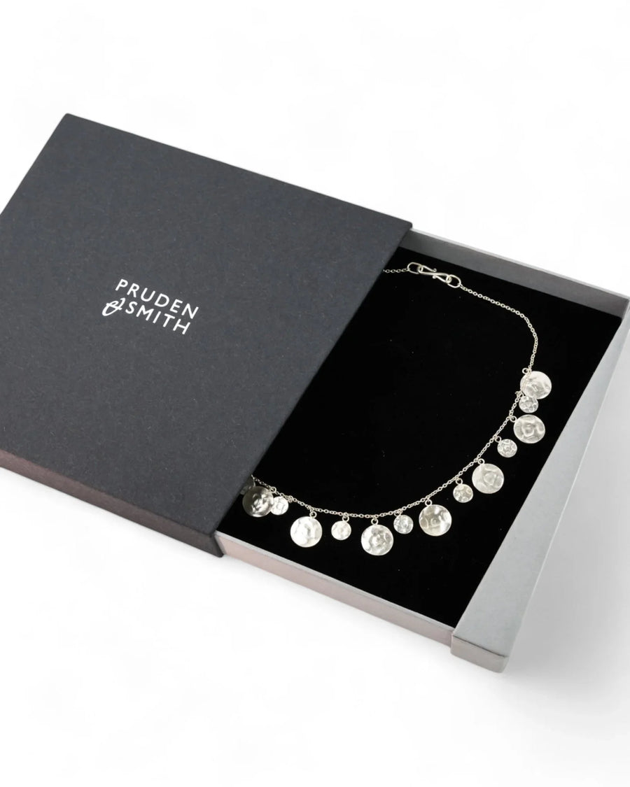 Handcrafted hammered silver round disc necklace on delicate chain in gift box