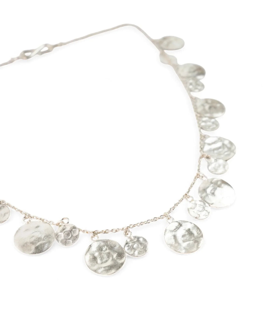Handmade hammered silver disc necklace with organic round shapes on a fine chain
