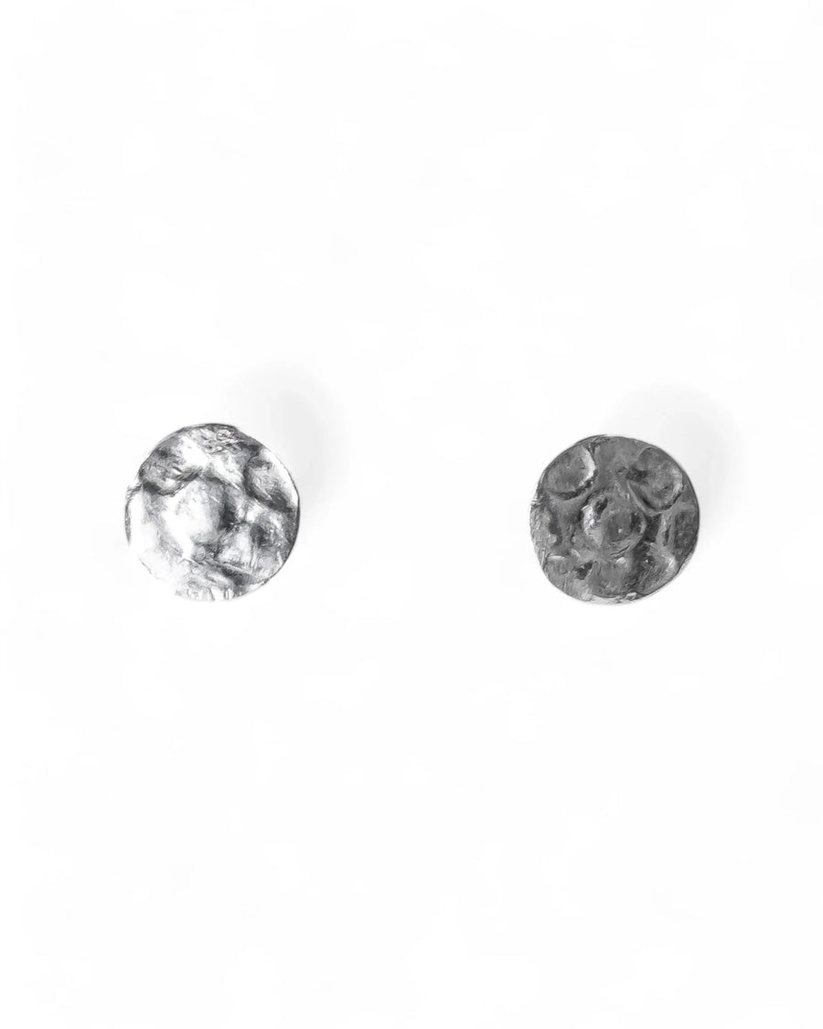 Silver-toned hammered stud earrings with a round, textured design.