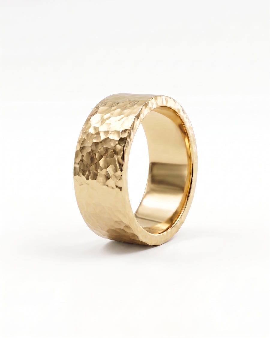 Men's flat hammered gold wedding ring.