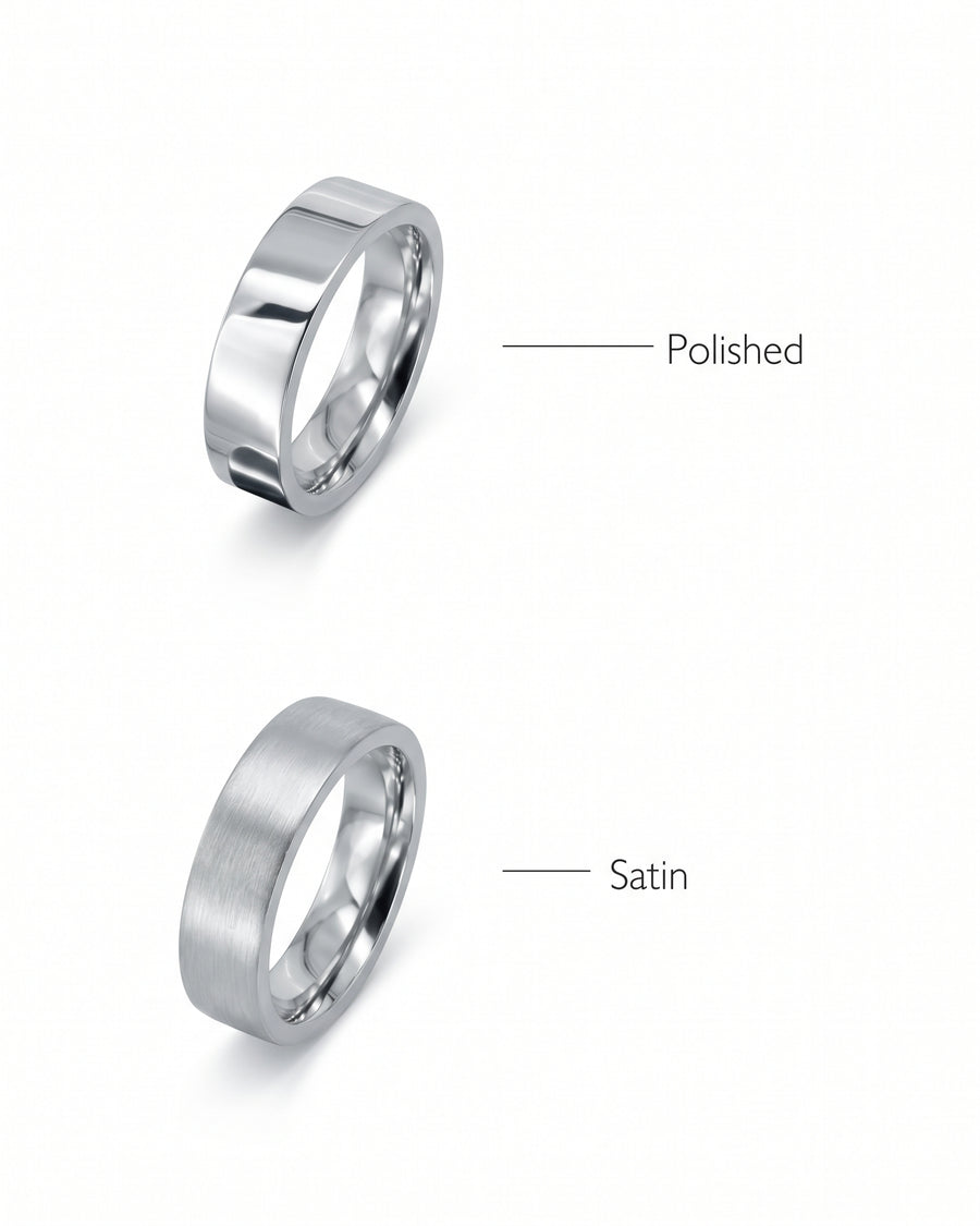 Two flat silver wedding rings, one with a polished finish and one with a satin finish.