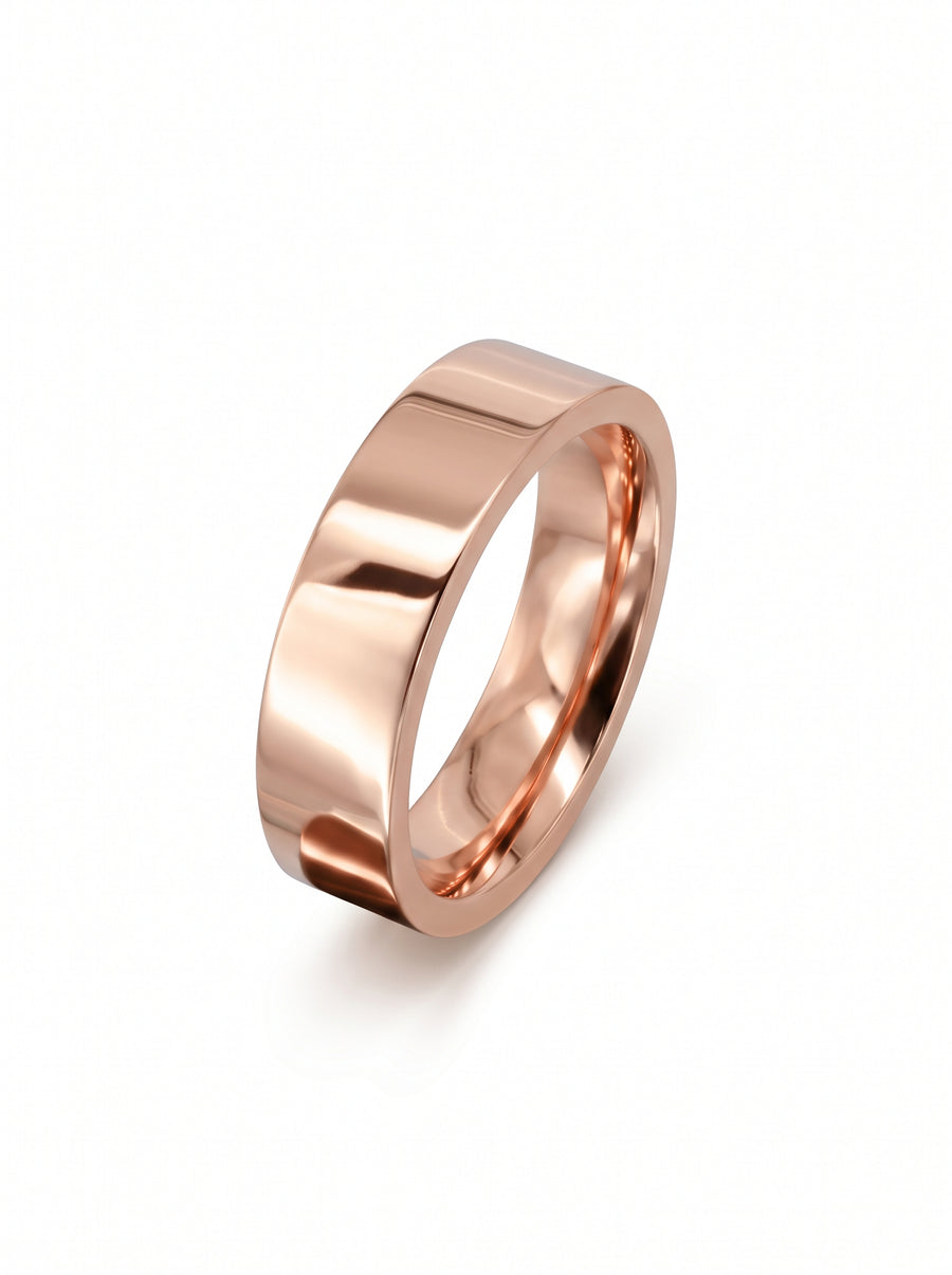 Polished rose gold flat wedding ring with a smooth, minimalist band design.