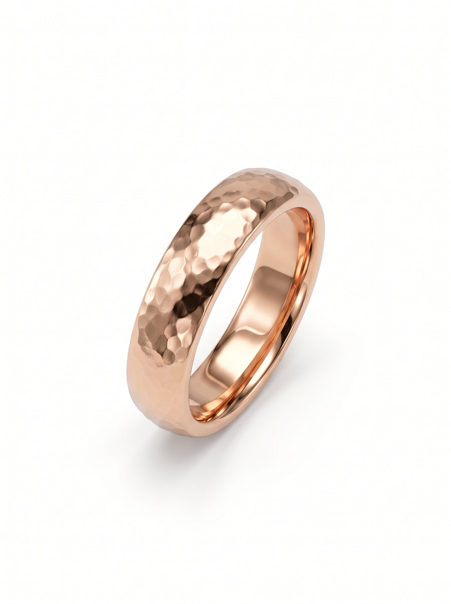 Rose gold wedding ring with a hammered texture and a smooth, polished inner band.