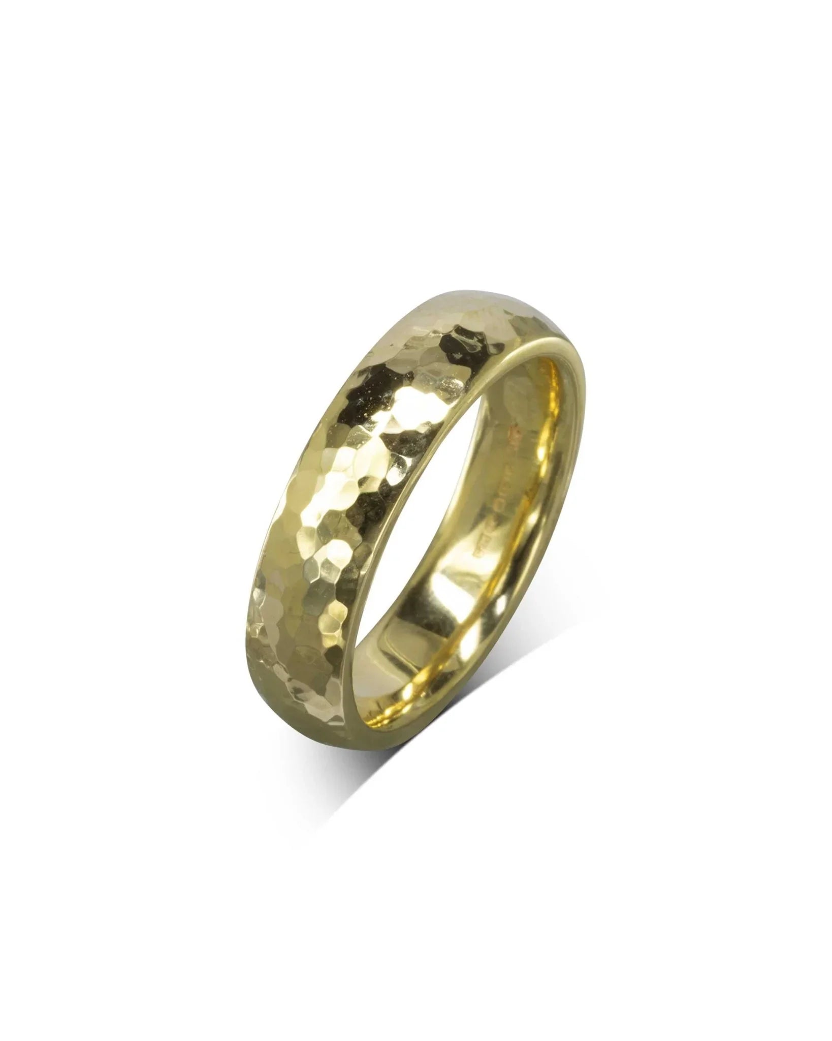 Gold hammered court wedding ring.