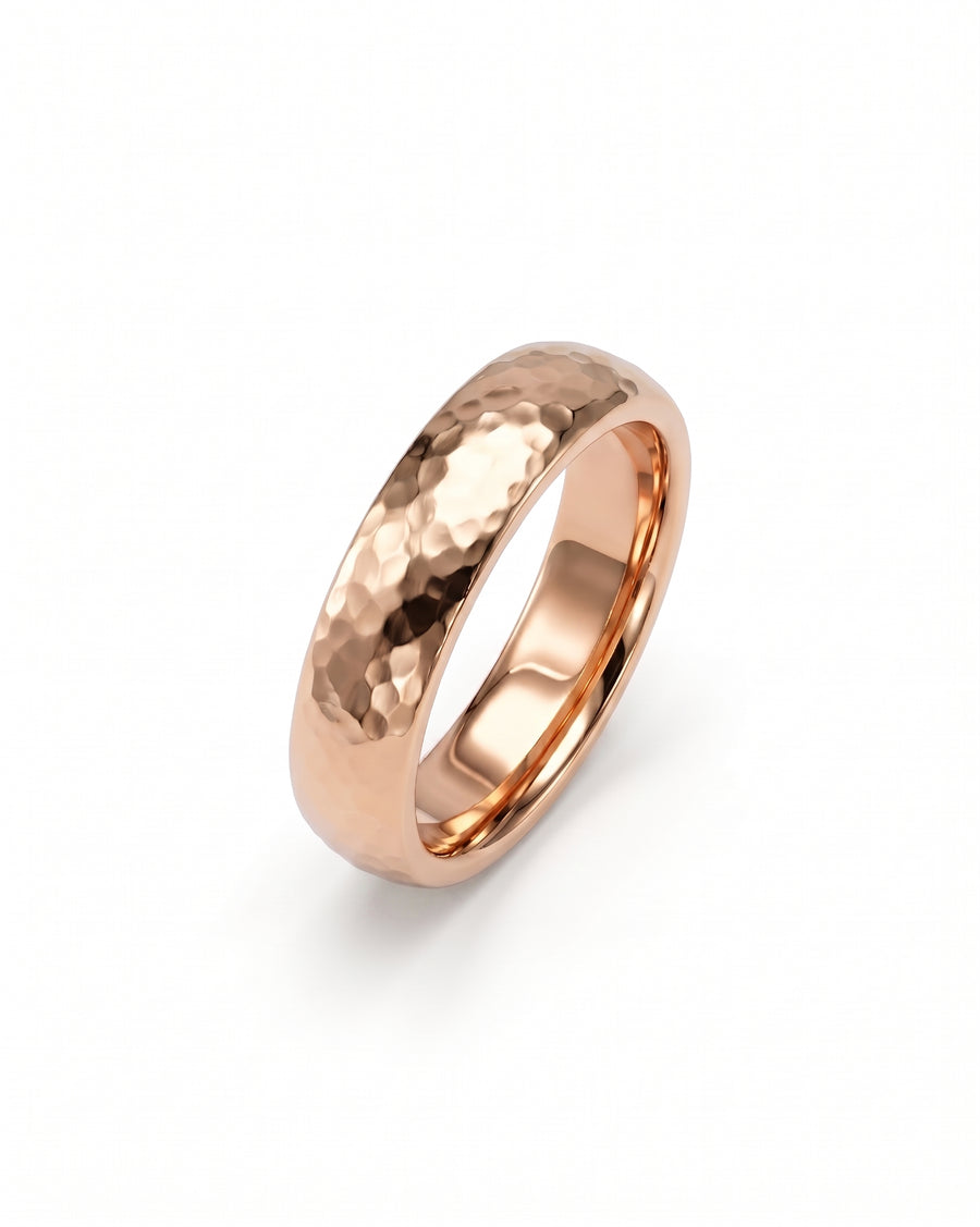 Rose gold court wedding ring with a textured hammered finish and a polished inner band.