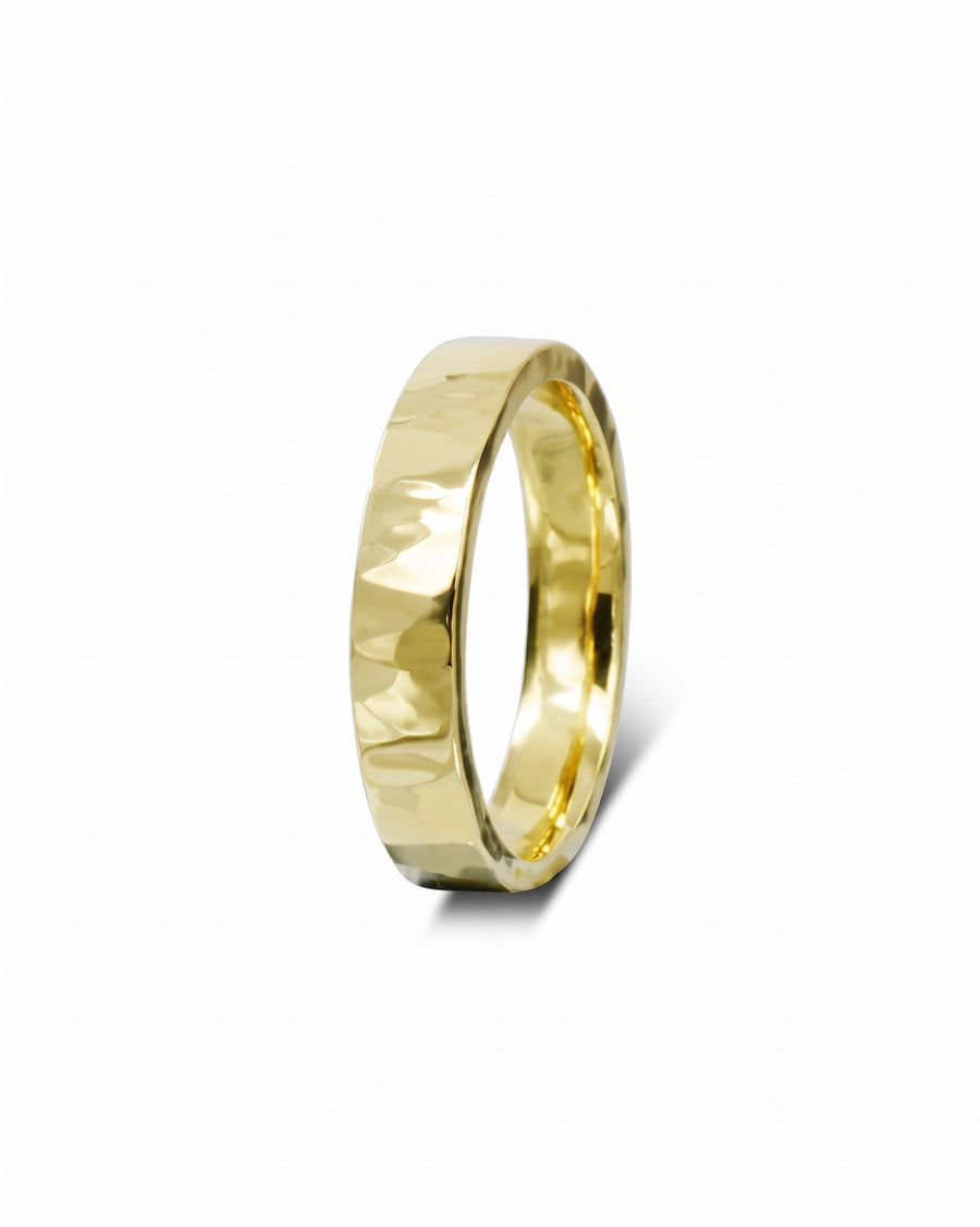Gold hammered wedding ring.