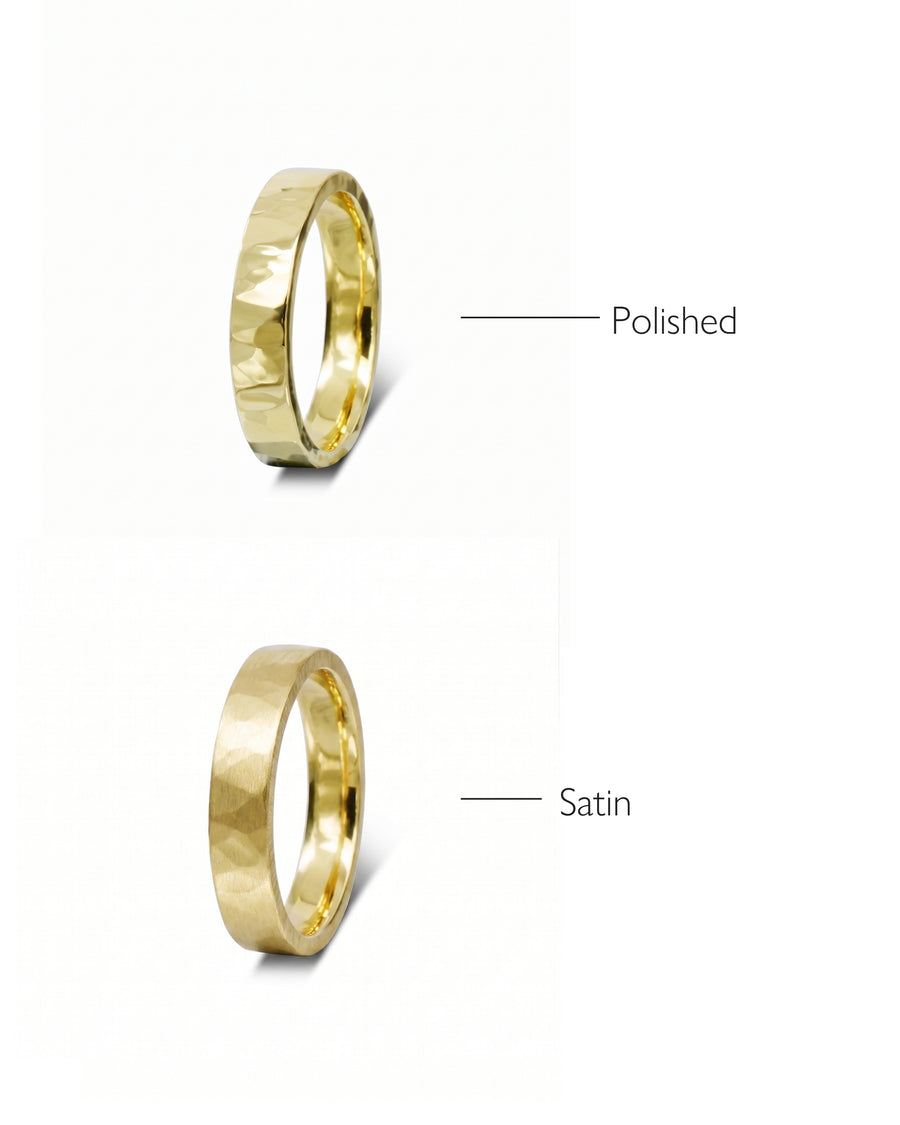 Two gold hammered wedding rings, one polished and one satin finish.