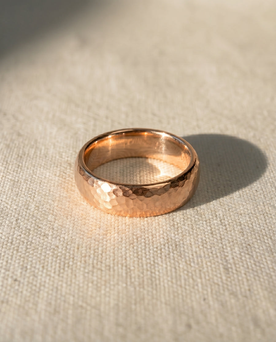 Rose gold matt hammered court wedding ring.