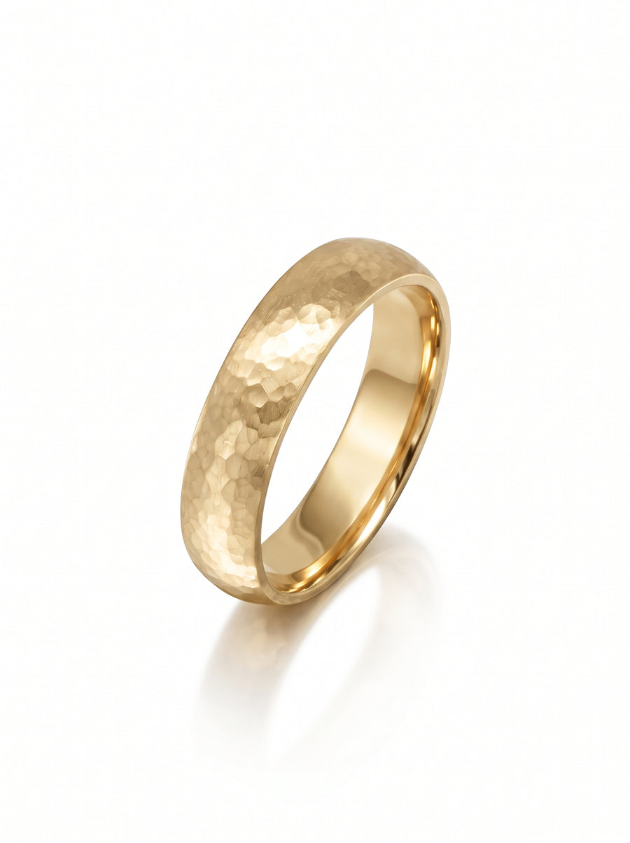 4mm 9ct yellow gold court wedding ring with a textured matt hammered finish.