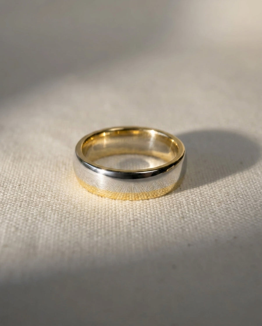 Silver and 18ct yellow gold 6mm smooth polished court shaped wedding band.