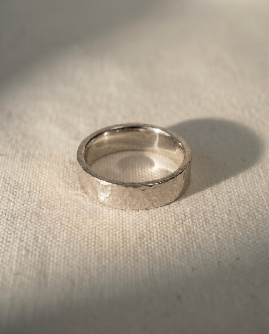 9ct white gold 4mm rough hammered wedding ring.