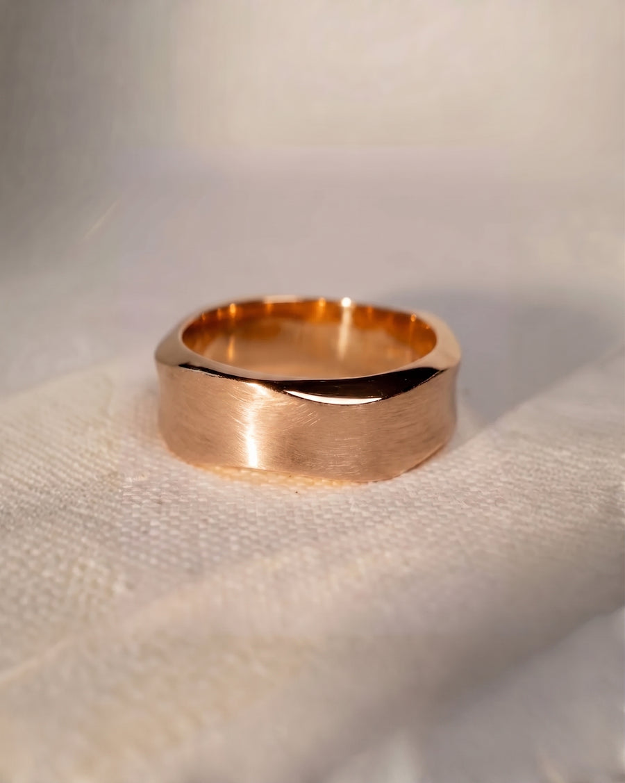 9ct rose gold 4mm men's wedding ring with a side hammered brushed finish.