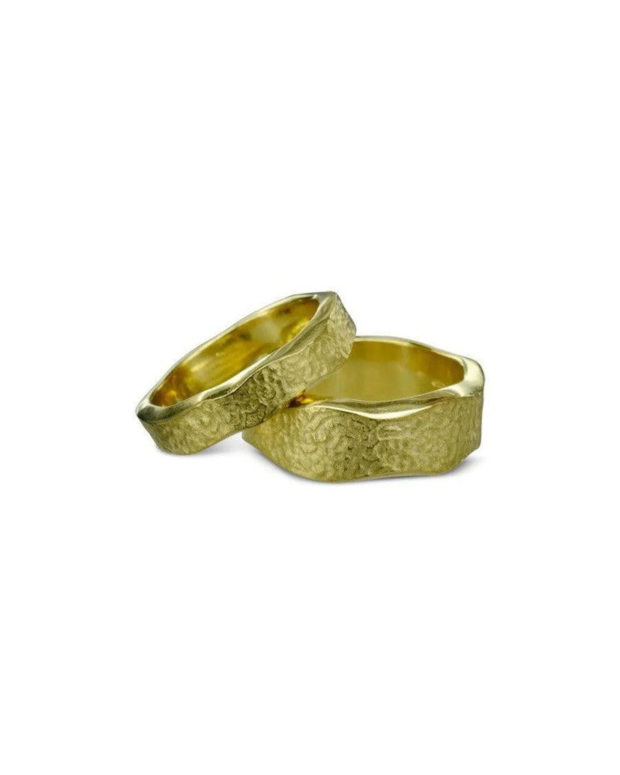 Handmade textured yellow gold wedding rings with hammered, organic finish