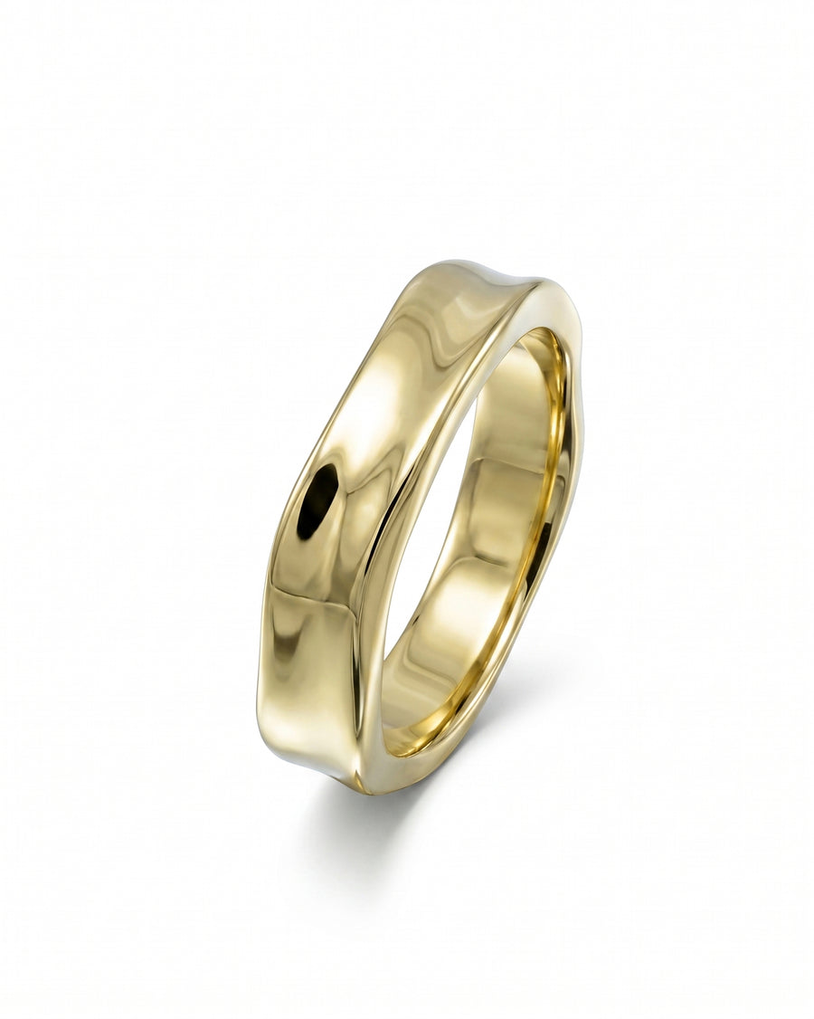 Gold men's wedding ring with a wavy, hammered side design.