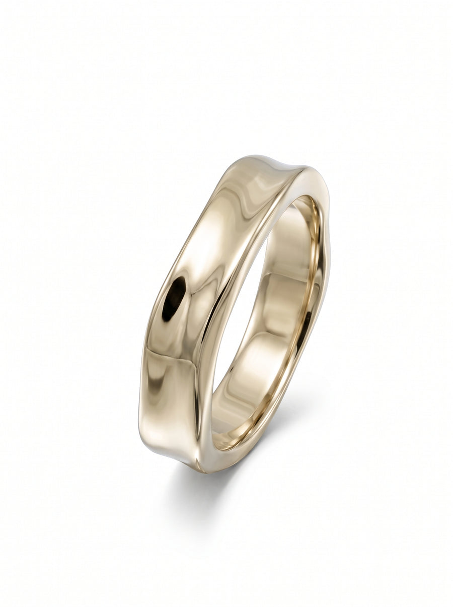 Polished yellow gold men's wedding ring with a wavy, hammered side design on a white background.