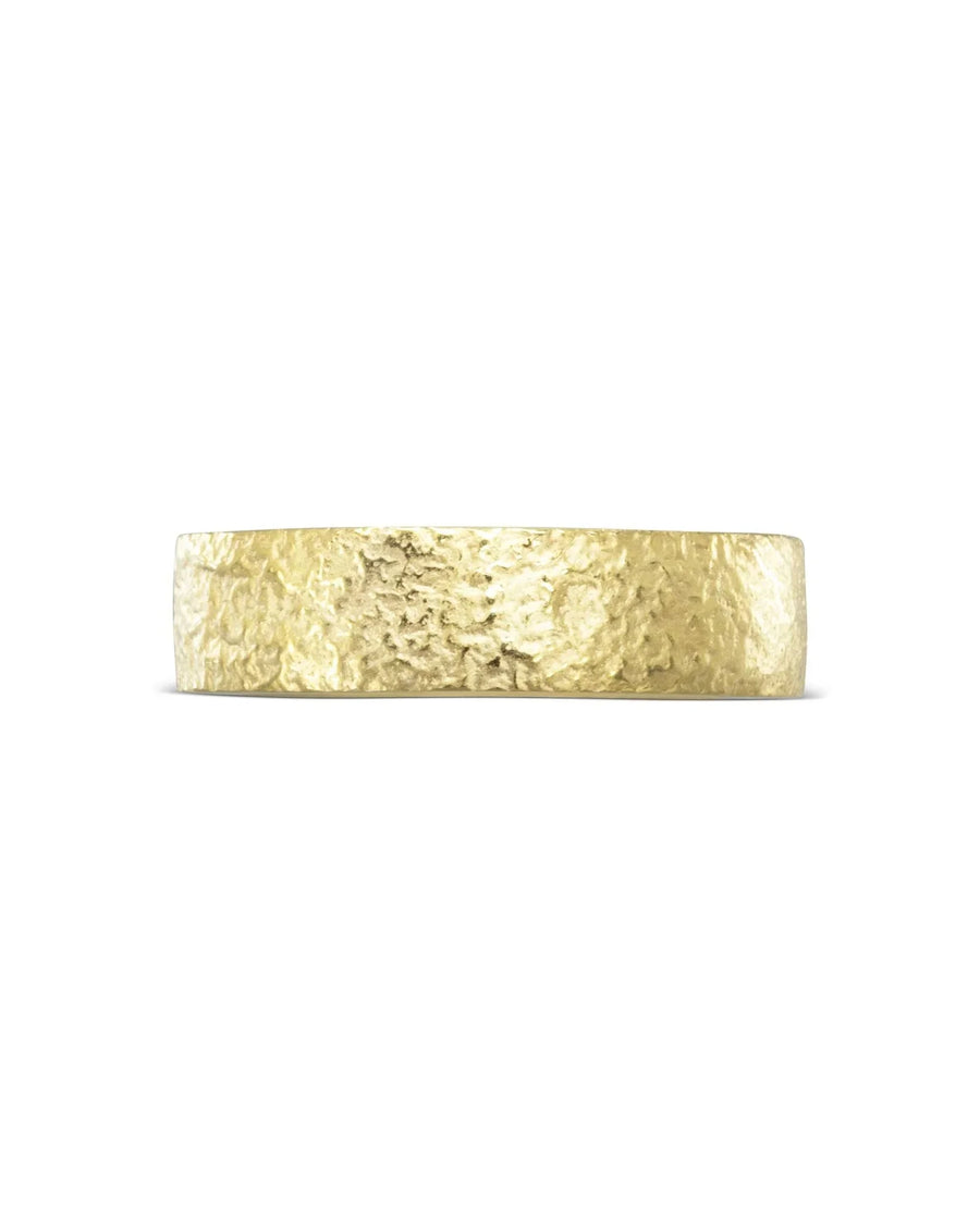Textured flat yellow gold wedding ring with a rustic hammered finish, 6mm wide