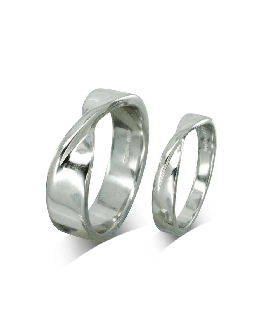 Two platinum twist wedding bands, one wider than the other.