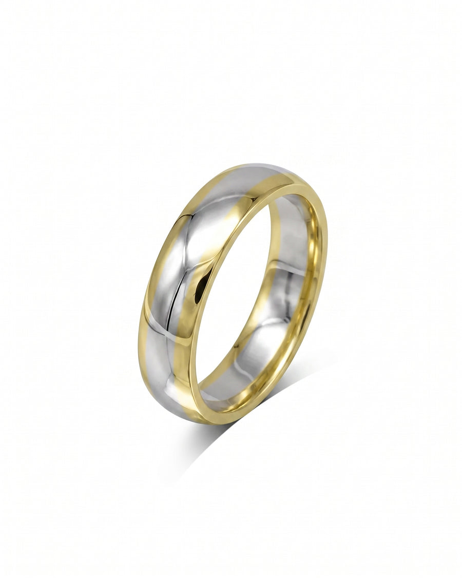 Mixed metal court shaped wedding band with gold and silver tones.