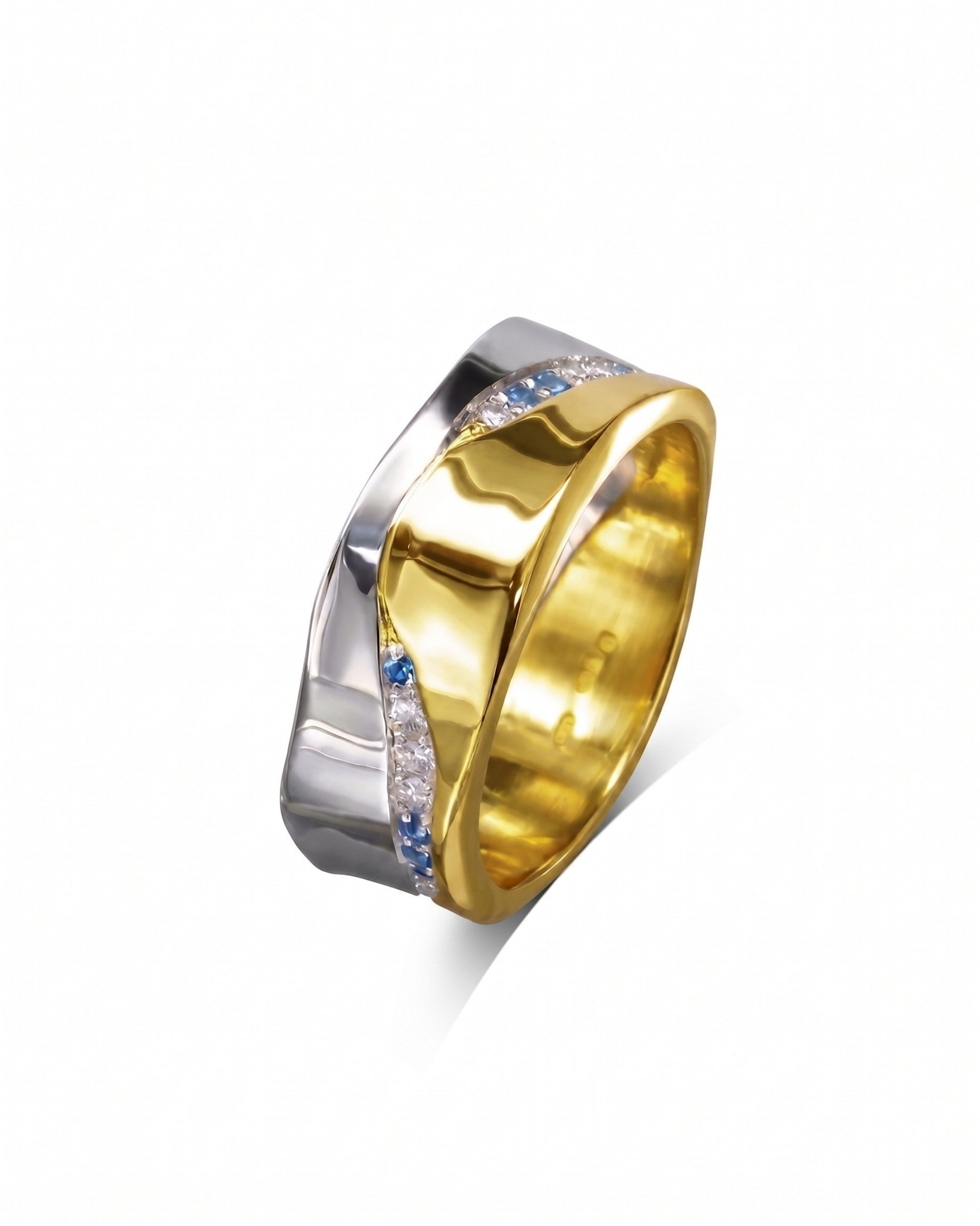 Mixed metal eternity ring with diamonds and sapphires.