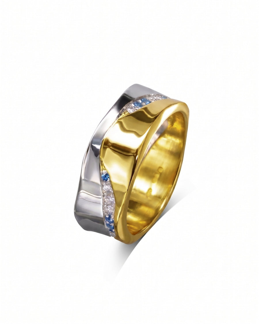 Mixed metal eternity ring with diamonds and sapphires.