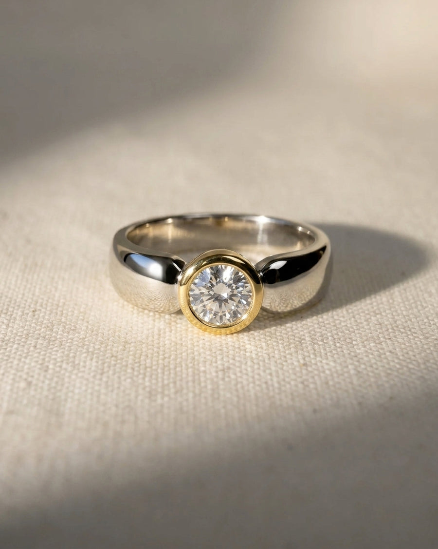 9ct white and yellow gold ring with a round diamond.