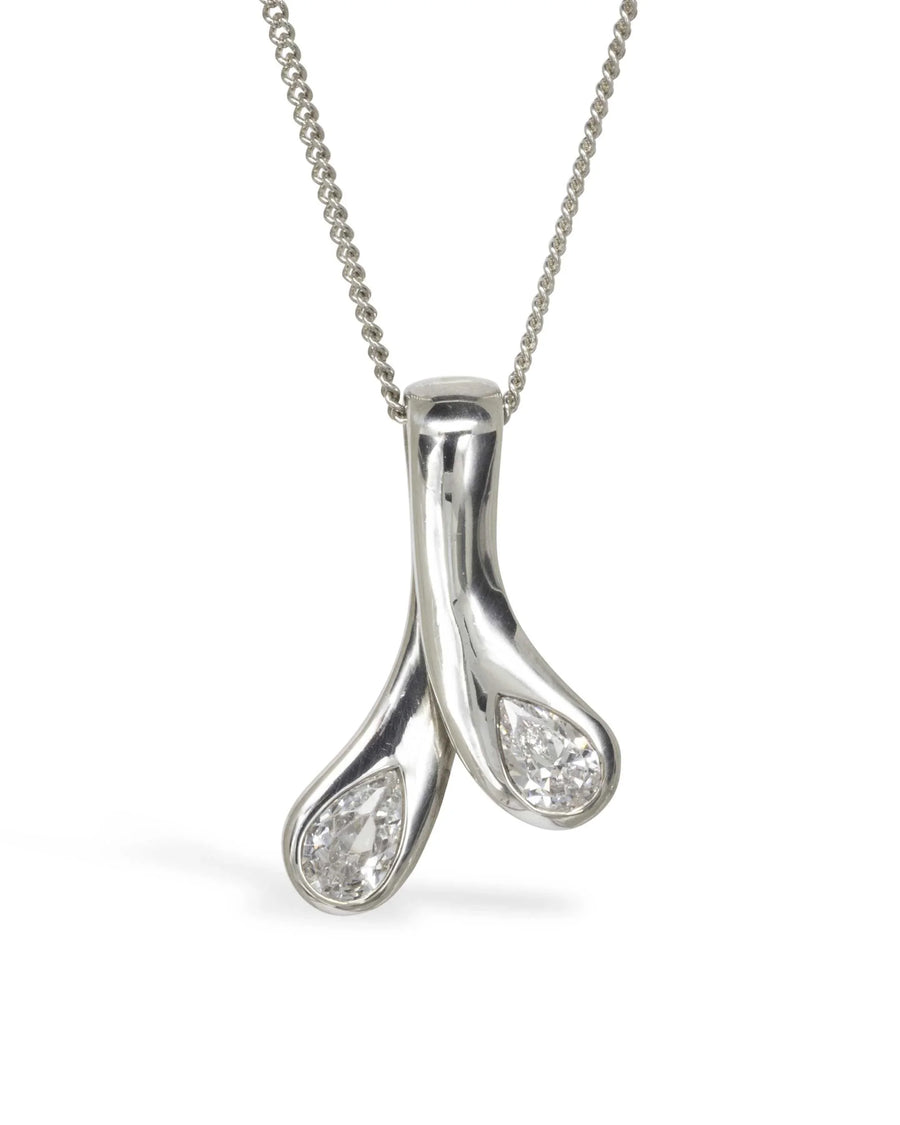Elegant teardrop diamond pendant necklace in polished silver with organic design