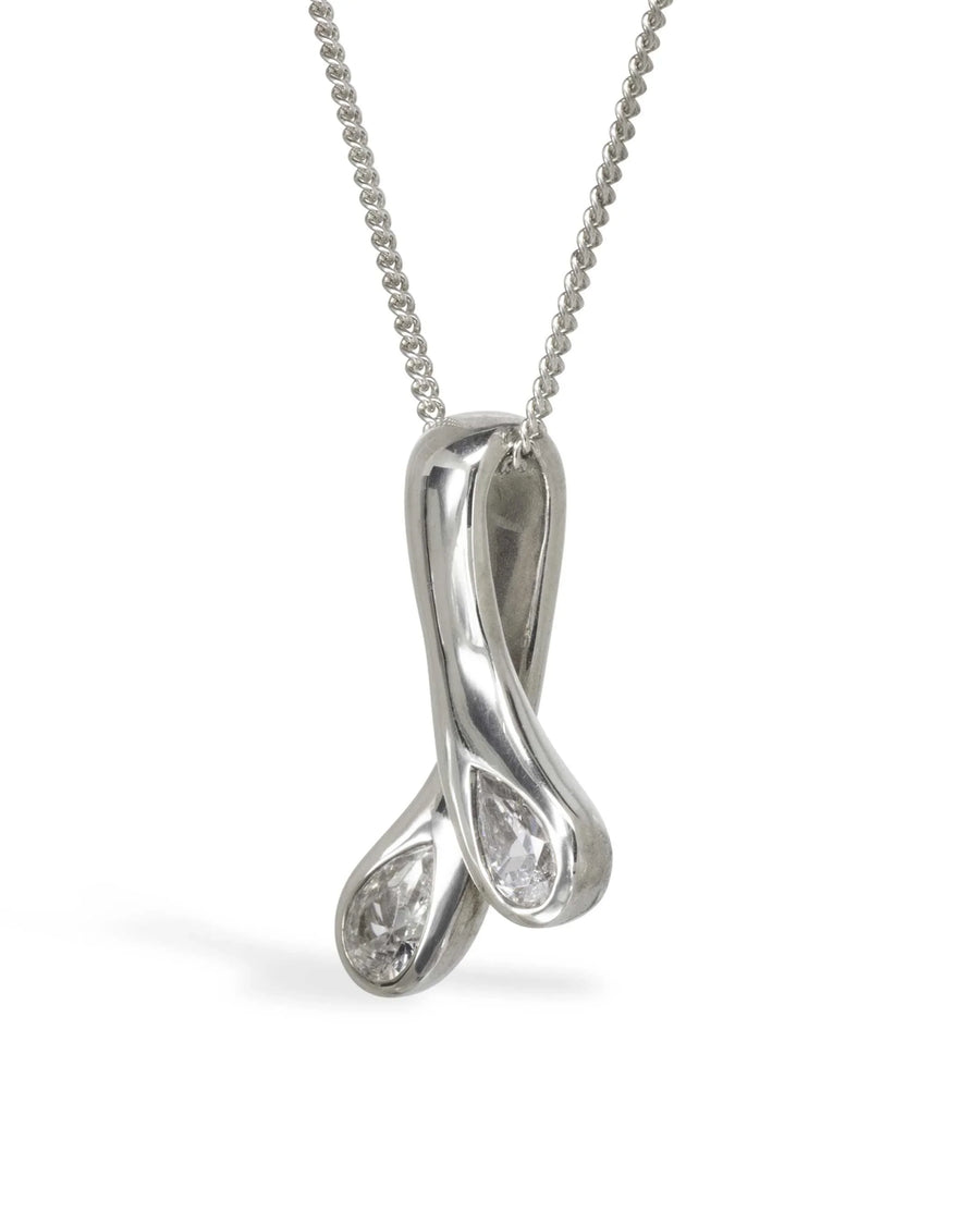 Silver necklace with two teardrop diamonds in a modern, intertwined pendant design
