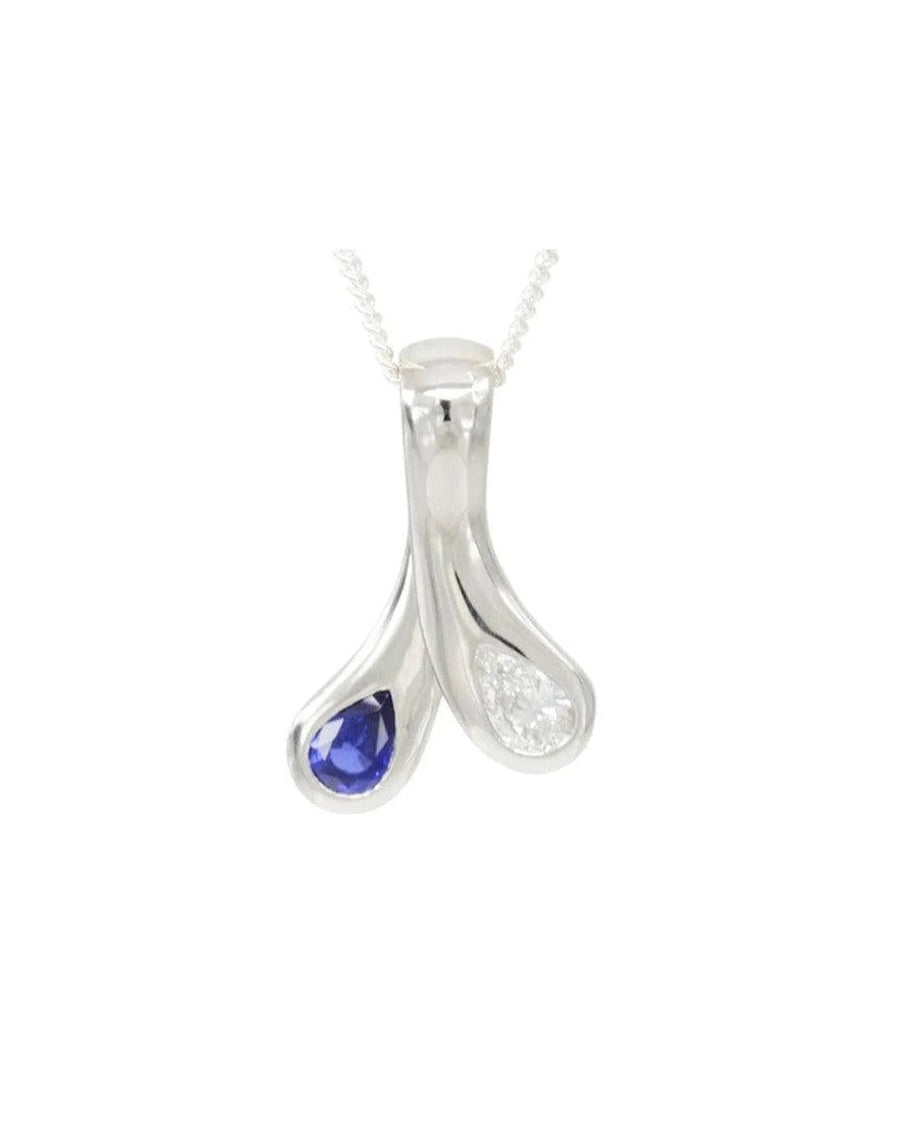 Sapphire and diamond teardrop pendant in white metal on fine chain