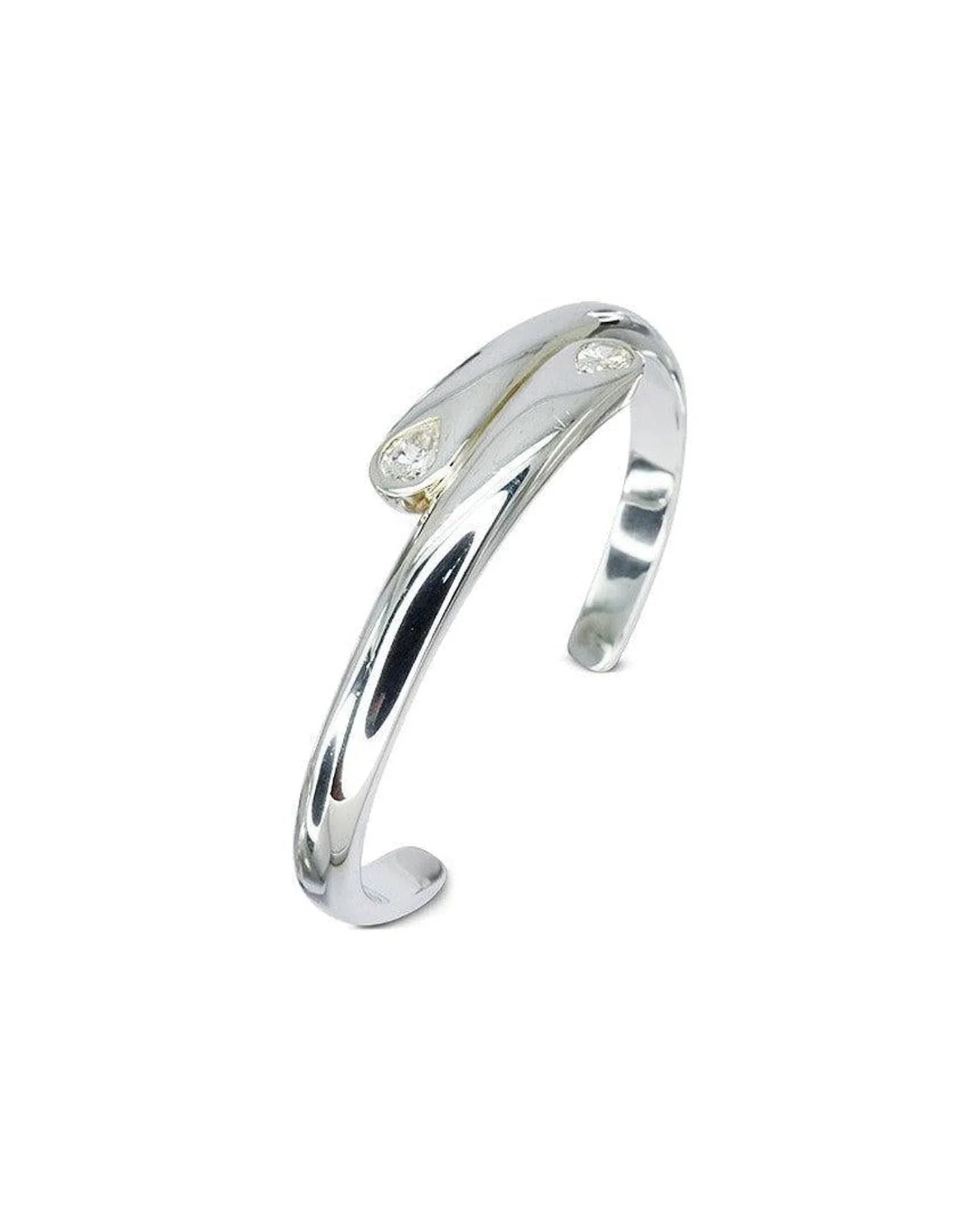Sterling silver cuff bangle with two pear-shaped diamonds on open ends, minimalist design