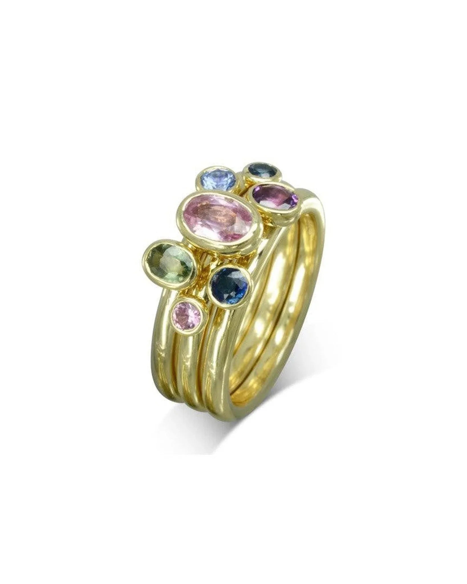 Gold stacking ring set with multi-coloured oval sapphires.
