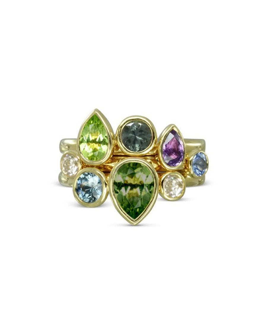 Gold stacking rings with multi-coloured pear and oval sapphires.